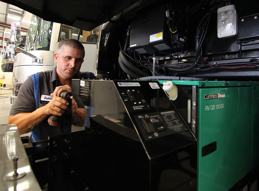 Service Tech Working on Motorhome Generator